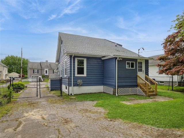 34 Woodland Ave, Poughkeepsie, NY 12603 - view of property exterior with a gate, roof with shingles, and entry steps