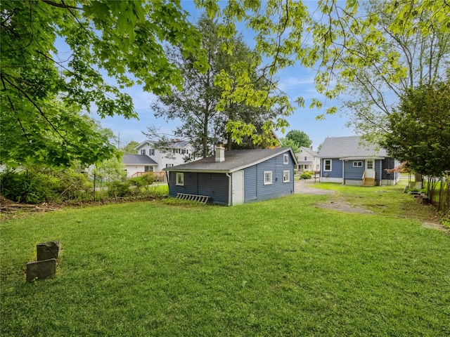 34 Woodland Ave, Poughkeepsie, NY 12603 - view of green lawn featuring an outbuilding