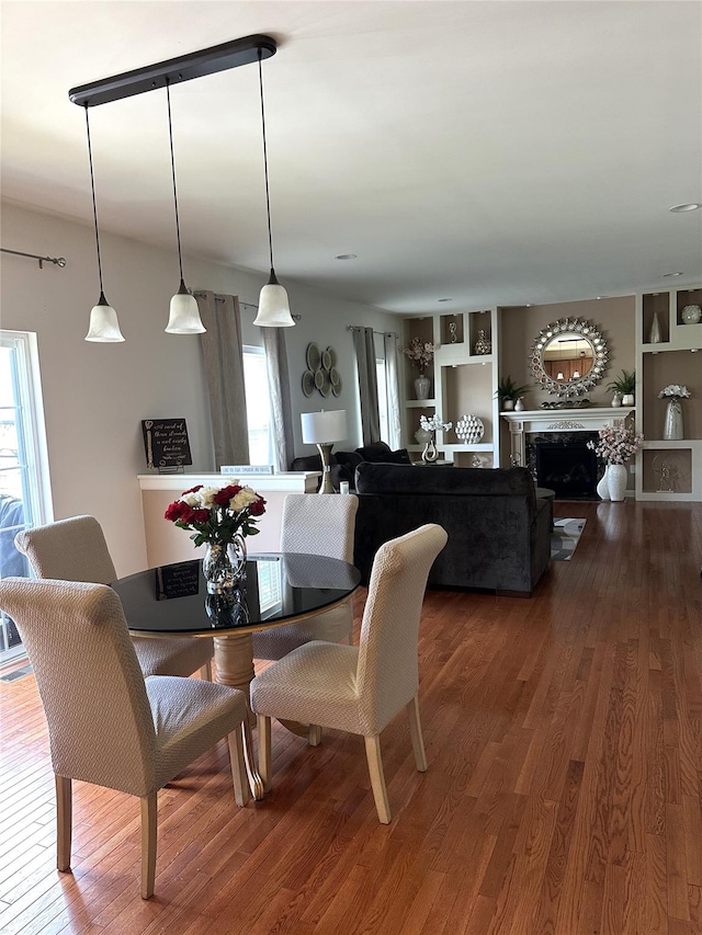38 Panorama Dr, New Windsor, NY 12553 - dining room featuring plenty of natural light, wood finished floors, built in features, and a fireplace