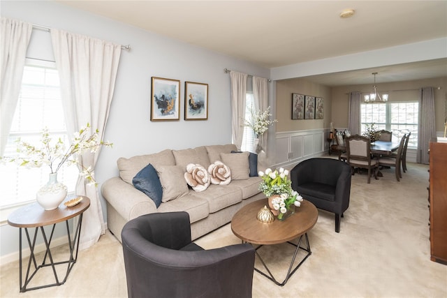 38 Panorama Dr, New Windsor, NY 12553 - living area featuring a chandelier, a wainscoted wall, light colored carpet, and a decorative wall