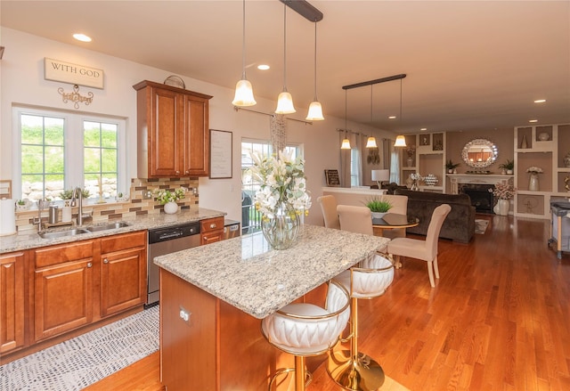 38 Panorama Dr, New Windsor, NY 12553 - kitchen with dishwasher, a sink, light wood finished floors, light stone counters, and recessed lighting