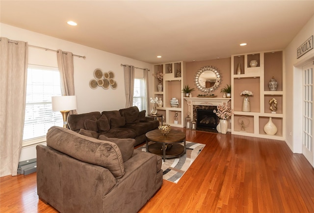 38 Panorama Dr, New Windsor, NY 12553 - living room featuring wood finished floors, a high end fireplace, recessed lighting, and built in features