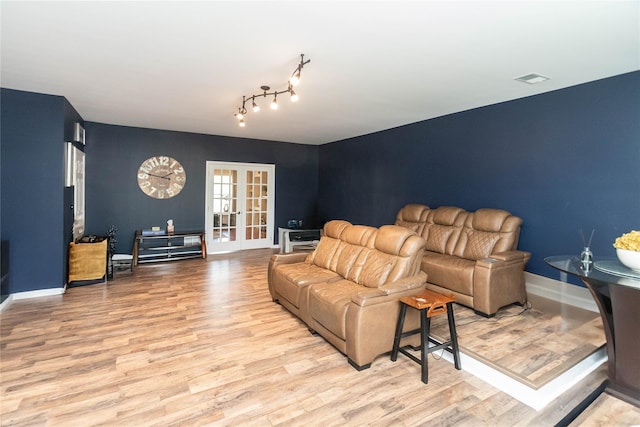 38 Panorama Dr, New Windsor, NY 12553 - living room with wood finished floors, french doors, and baseboards