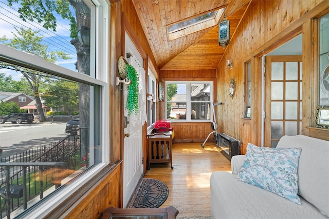 1370 Kearney Ave, Bronx, NY 10465 - sunroom with lofted ceiling, a skylight, wood-type flooring, wood walls, and wooden ceiling