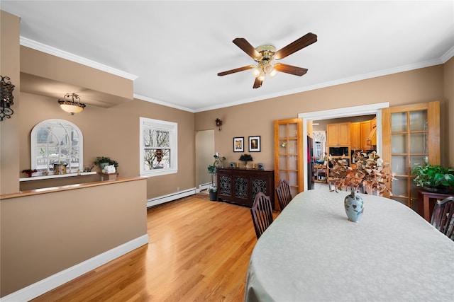1370 Kearney Ave, Bronx, NY 10465 - dining area with a baseboard heating unit, light wood-style flooring, ornamental molding, ceiling fan, and french doors