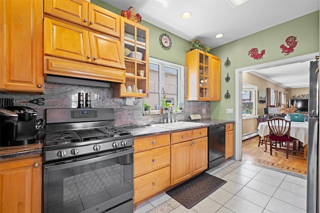 1370 Kearney Ave, Bronx, NY 10465 - kitchen featuring black appliances, a sink, backsplash, light tile patterned floors, and a baseboard radiator