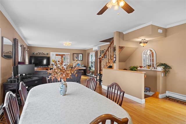 1370 Kearney Ave, Bronx, NY 10465 - dining room with wood finished floors, a baseboard radiator, a ceiling fan, ornamental molding, and baseboards
