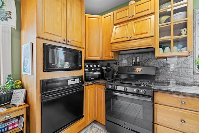1370 Kearney Ave, Bronx, NY 10465 - kitchen featuring black appliances, light tile patterned floors, decorative backsplash, and dark stone countertops