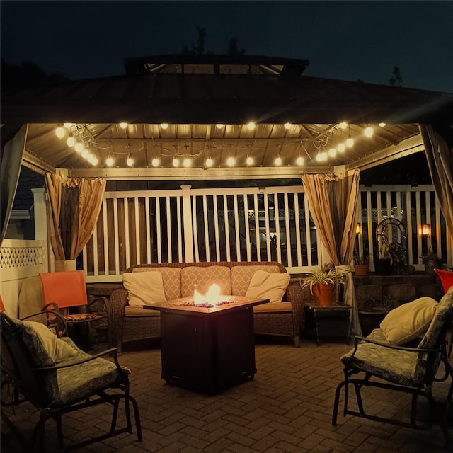 1370 Kearney Ave, Bronx, NY 10465 - patio at night with an outdoor living space with a fire pit, a pergola, and a patio