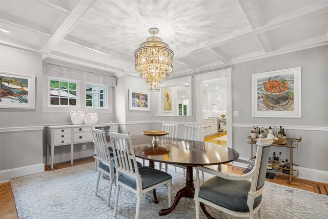 489 Manor Ln, Pelham, NY 10803 - dining area with coffered ceiling, a chandelier, baseboards, ornamental molding, and beam ceiling