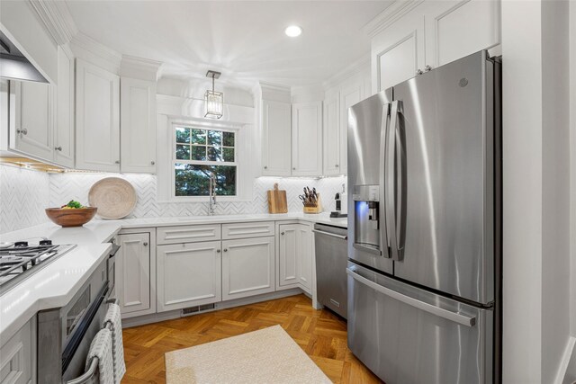 489 Manor Ln, Pelham, NY 10803 - kitchen with stainless steel appliances, recessed lighting, light countertops, white cabinets, and backsplash