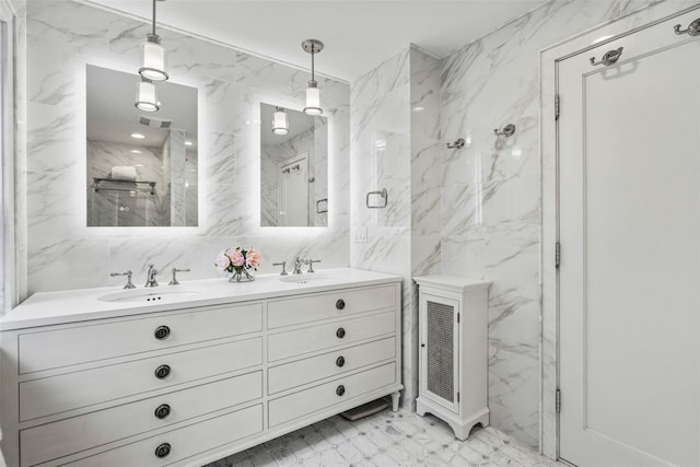 489 Manor Ln, Pelham, NY 10803 - full bathroom with tile walls, double vanity, marble finish flooring, and a marble finish shower