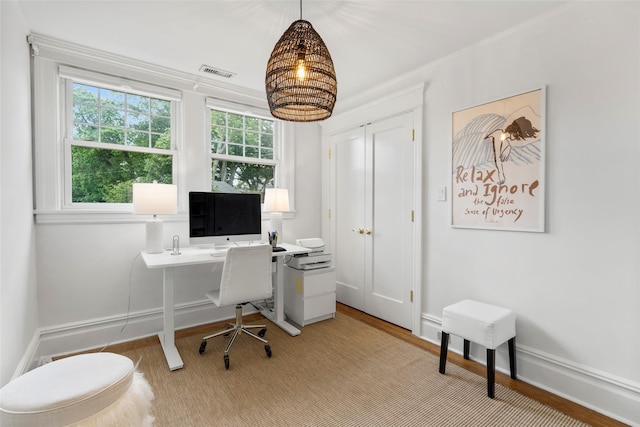 489 Manor Ln, Pelham, NY 10803 - home office featuring healthy amount of natural light, light wood finished floors, baseboards, and crown molding