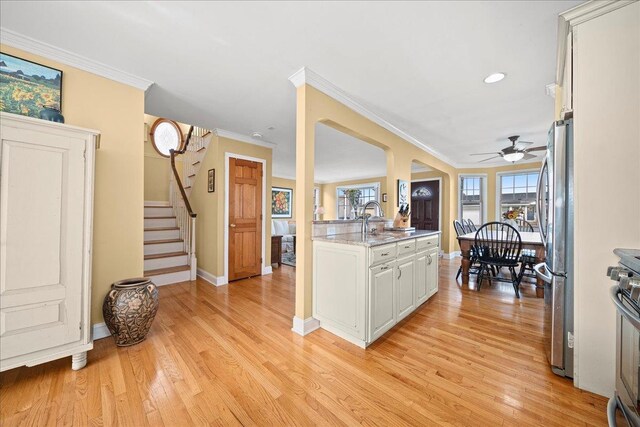 16 Gibbs Rd, Amity Harbor, NY 11701 - kitchen featuring freestanding refrigerator, baseboards, light wood-style flooring, ceiling fan, and crown molding