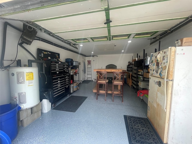 16 Gibbs Rd, Amity Harbor, NY 11701 - garage with freestanding refrigerator and electric water heater