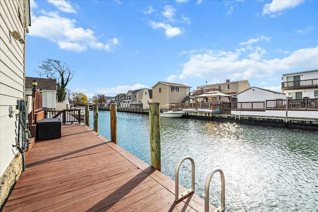 16 Gibbs Rd, Amity Harbor, NY 11701 - dock with a water view and a residential view
