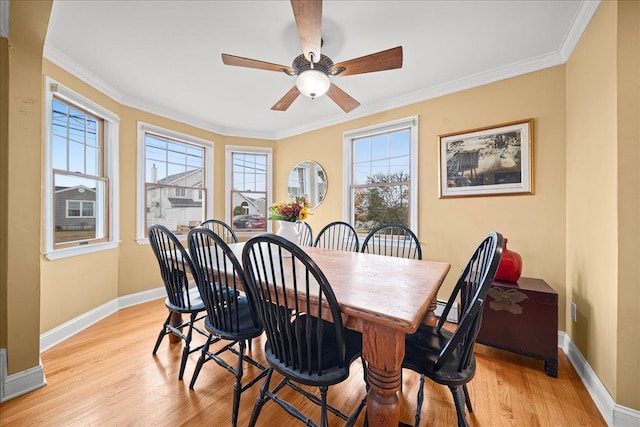16 Gibbs Rd, Amity Harbor, NY 11701 - dining area with baseboards, light wood-style floors, ornamental molding, and ceiling fan