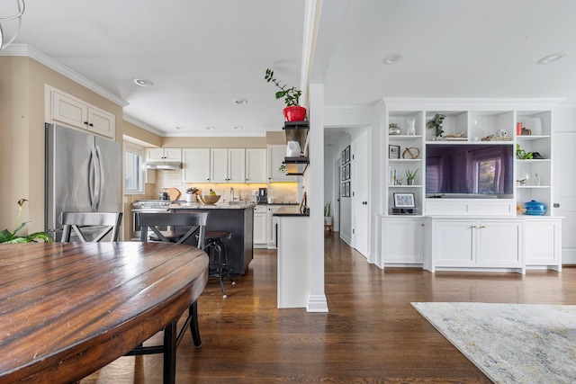 1696 Coral Rd, East Meadow, NY 11554 - dining area featuring crown molding, dark wood-style floors, and recessed lighting