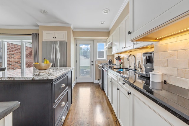 1696 Coral Rd, East Meadow, NY 11554 - kitchen with appliances with stainless steel finishes, a sink, white cabinetry, crown molding, and recessed lighting