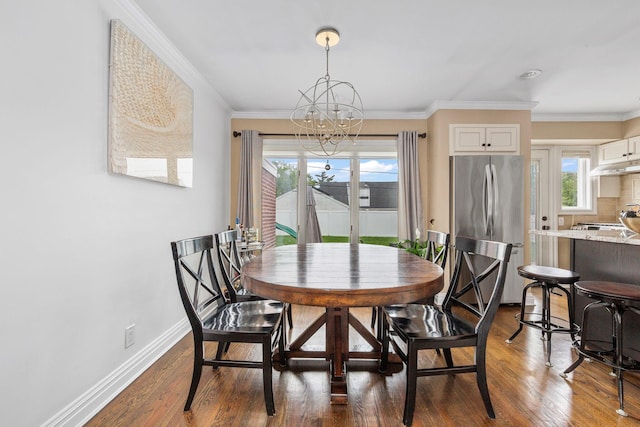 1696 Coral Rd, East Meadow, NY 11554 - dining area with a chandelier, dark wood-style flooring, baseboards, and ornamental molding