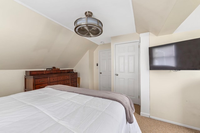 1696 Coral Rd, East Meadow, NY 11554 - carpeted bedroom with lofted ceiling and baseboards