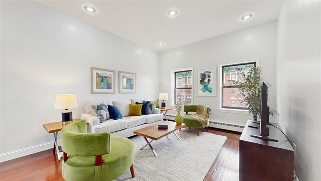 2611 Frederick Douglass Blvd Unit 5D, New York Manhattan, NY 10030 - living room with a baseboard radiator, wood finished floors, recessed lighting, and baseboards