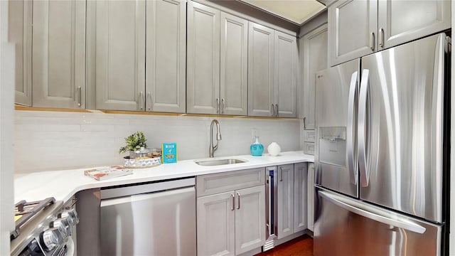 2611 Frederick Douglass Blvd Unit 5D, New York Manhattan, NY 10030 - kitchen featuring appliances with stainless steel finishes, a sink, backsplash, and light countertops