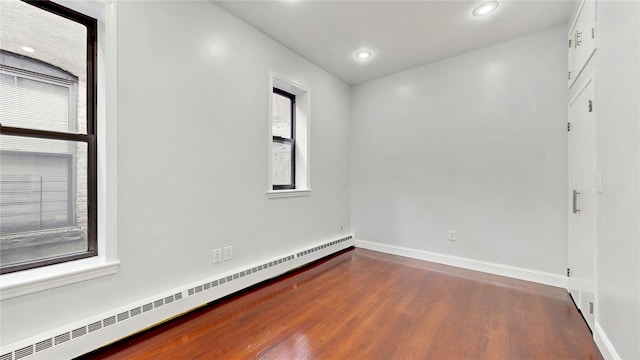 2611 Frederick Douglass Blvd Unit 5D, New York Manhattan, NY 10030 - empty room featuring a baseboard radiator, dark wood-style floors, baseboards, and recessed lighting