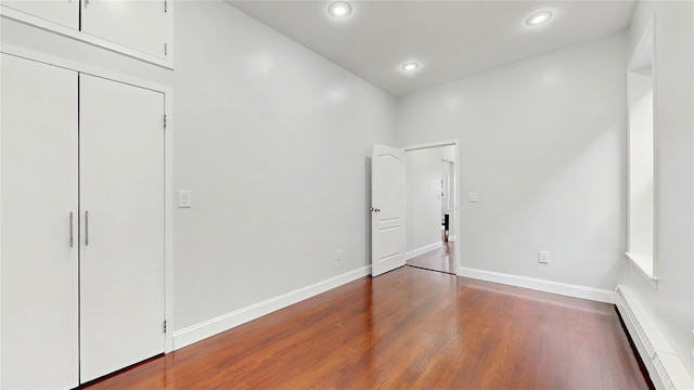 2611 Frederick Douglass Blvd Unit 5D, New York Manhattan, NY 10030 - unfurnished bedroom with a baseboard radiator, wood finished floors, recessed lighting, and baseboards