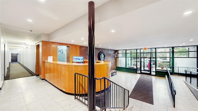 2611 Frederick Douglass Blvd Unit 5D, New York Manhattan, NY 10030 - welcome area with recessed lighting, a wall of windows, and brick wall
