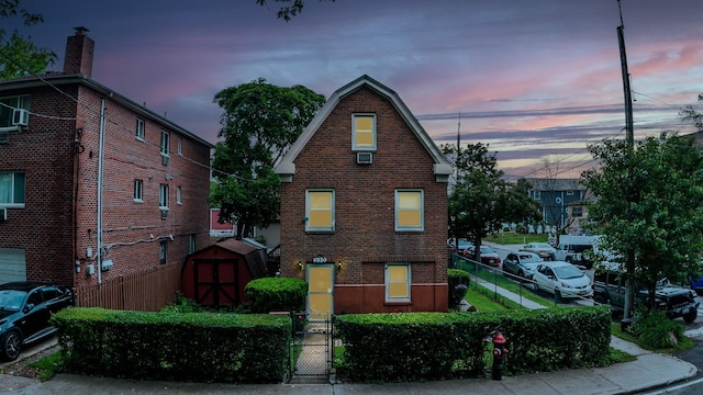 230 Pennyfield Ave, Bronx, NY 10465 - view of front of home featuring brick siding and a gate