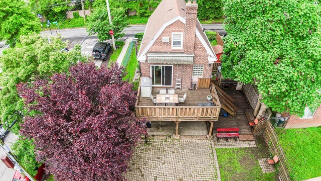 230 Pennyfield Ave, Bronx, NY 10465 - back of house featuring a deck, brick siding, and a chimney