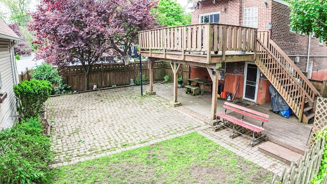 230 Pennyfield Ave, Bronx, NY 10465 - fenced backyard with a deck, a patio, and stairs