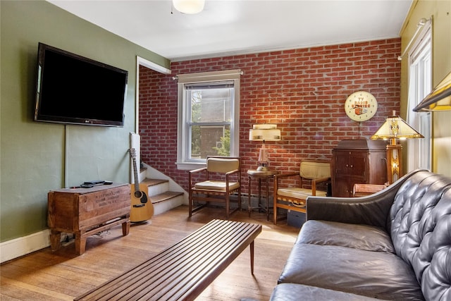 230 Pennyfield Ave, Bronx, NY 10465 - living area featuring hardwood / wood-style floors and brick wall
