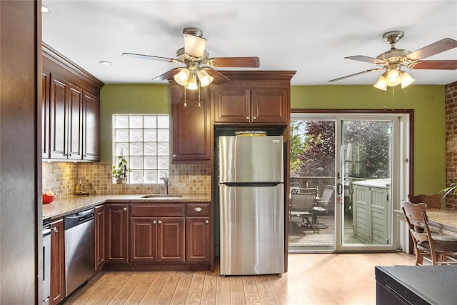 230 Pennyfield Ave, Bronx, NY 10465 - kitchen with appliances with stainless steel finishes, ceiling fan, a sink, and light wood-style floors