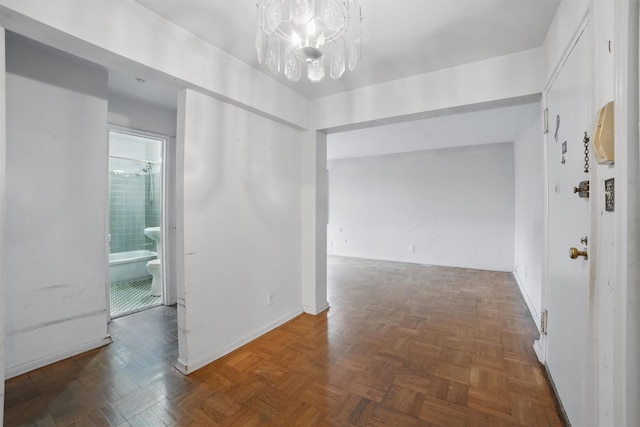 682 Tuckahoe Rd Unit 1A, Yonkers, NY 10710 - corridor with a chandelier and baseboards