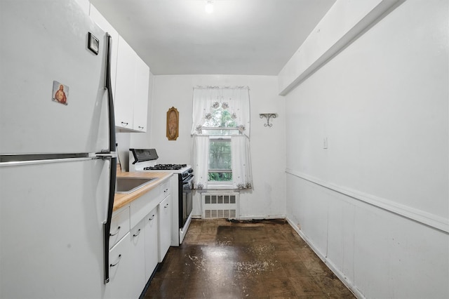 682 Tuckahoe Rd Unit 1A, Yonkers, NY 10710 - kitchen featuring freestanding refrigerator, gas stove, white cabinetry, radiator heating unit, and light countertops