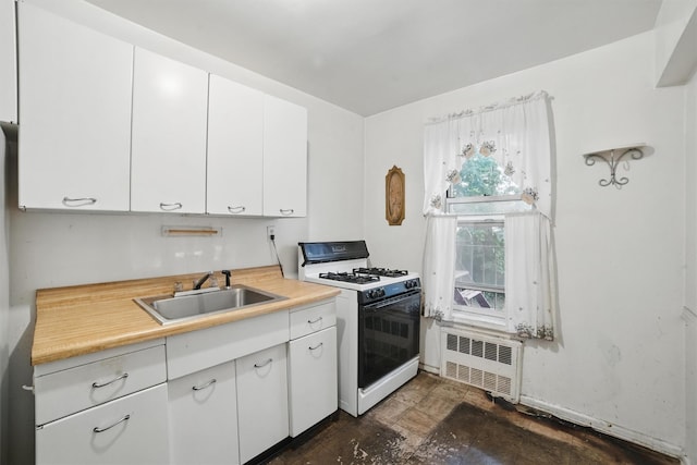 682 Tuckahoe Rd Unit 1A, Yonkers, NY 10710 - kitchen featuring white gas range oven, radiator, a sink, light countertops, and white cabinetry