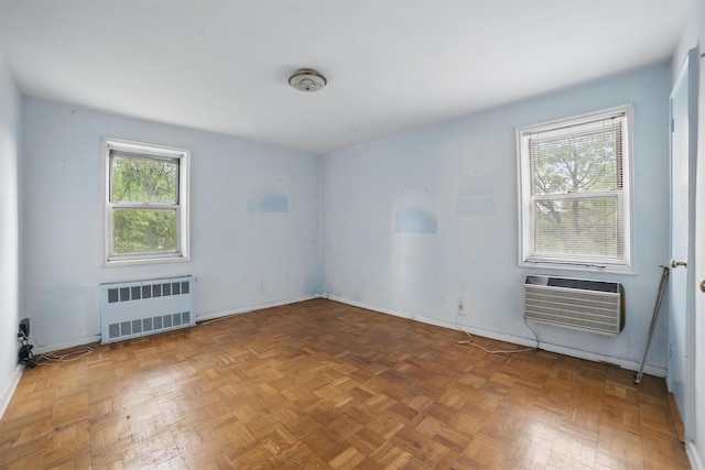 682 Tuckahoe Rd Unit 1A, Yonkers, NY 10710 - spare room featuring radiator heating unit, a wall mounted AC, and baseboards