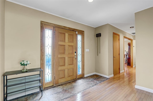 12 Bridle Path Ln, Port Jefferson, NY 11777 - entryway with baseboards, light wood-style floors, crown molding, and recessed lighting