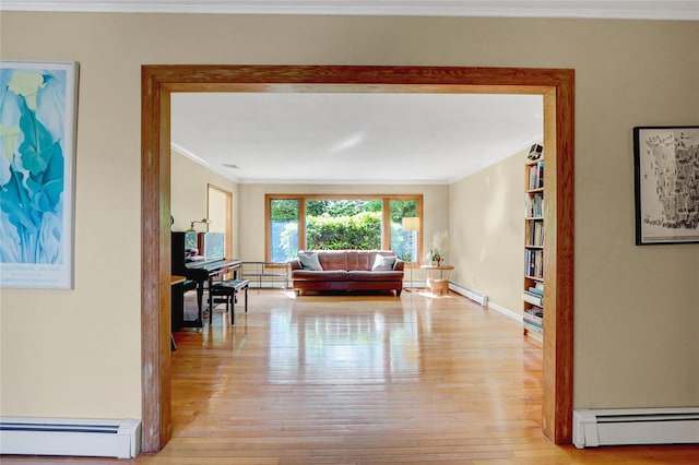 12 Bridle Path Ln, Port Jefferson, NY 11777 - living room featuring baseboard heating, ornamental molding, light wood-style flooring, baseboards, and a baseboard radiator