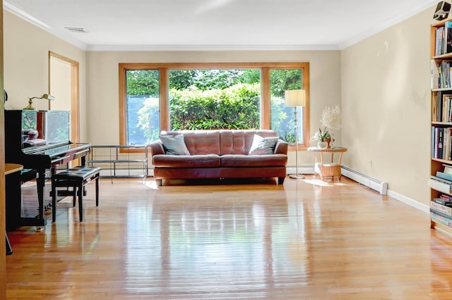 12 Bridle Path Ln, Port Jefferson, NY 11777 - living area featuring a baseboard heating unit, plenty of natural light, light wood finished floors, ornamental molding, and baseboards