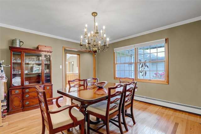 12 Bridle Path Ln, Port Jefferson, NY 11777 - dining space with light wood-type flooring, a chandelier, crown molding, and baseboard heating
