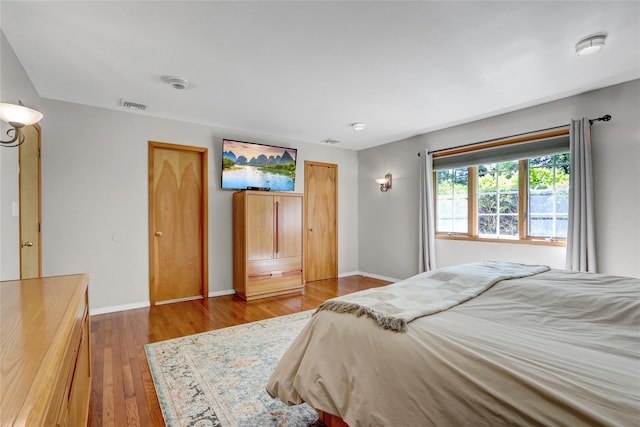 12 Bridle Path Ln, Port Jefferson, NY 11777 - bedroom with wood finished floors and baseboards