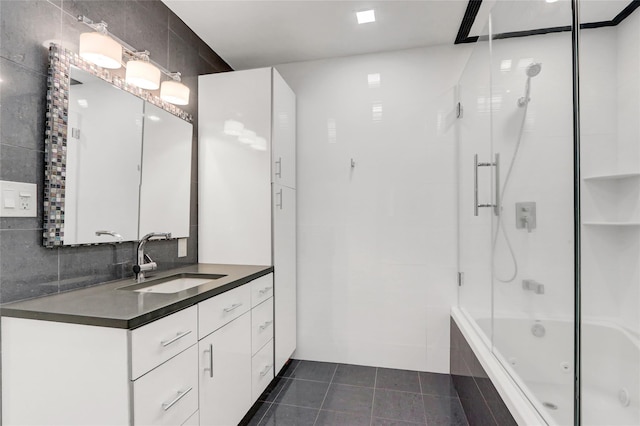 12 Bridle Path Ln, Port Jefferson, NY 11777 - bathroom featuring vanity, tiled shower / bath combo, tile walls, and tile patterned floors