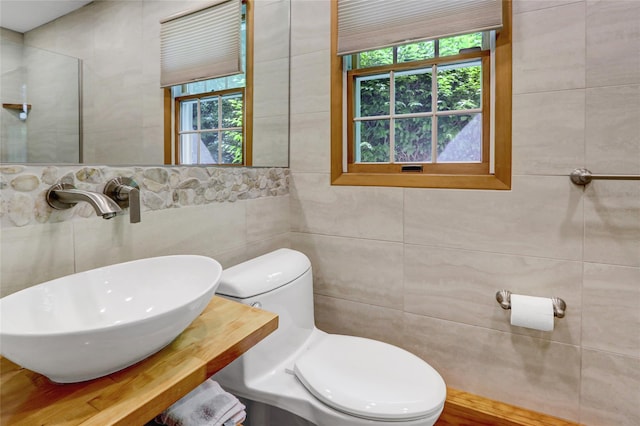 12 Bridle Path Ln, Port Jefferson, NY 11777 - half bath featuring a sink, tile walls, and toilet