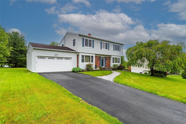 57 Decker Dr, Washingtonville, NY 10992 - colonial inspired home with an attached garage, driveway, a chimney, and a front yard