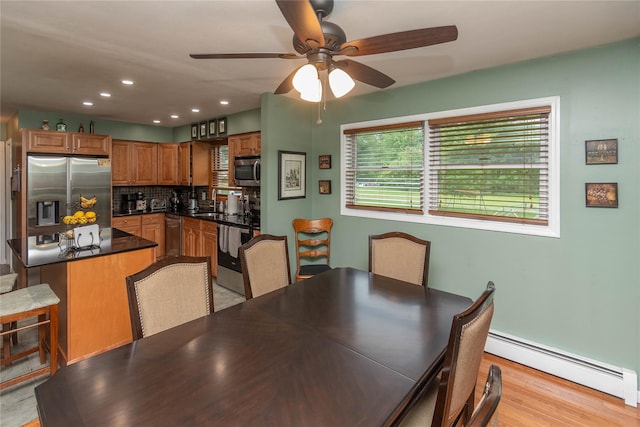 57 Decker Dr, Washingtonville, NY 10992 - dining room with a baseboard heating unit, light wood-type flooring, a ceiling fan, and recessed lighting
