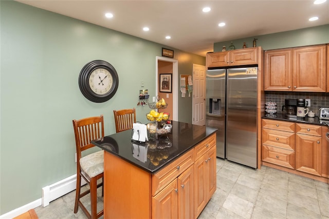 57 Decker Dr, Washingtonville, NY 10992 - kitchen with stainless steel fridge, a baseboard radiator, recessed lighting, a center island, and backsplash
