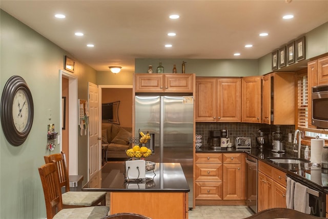 57 Decker Dr, Washingtonville, NY 10992 - kitchen featuring a sink, recessed lighting, dark countertops, stainless steel appliances, and decorative backsplash